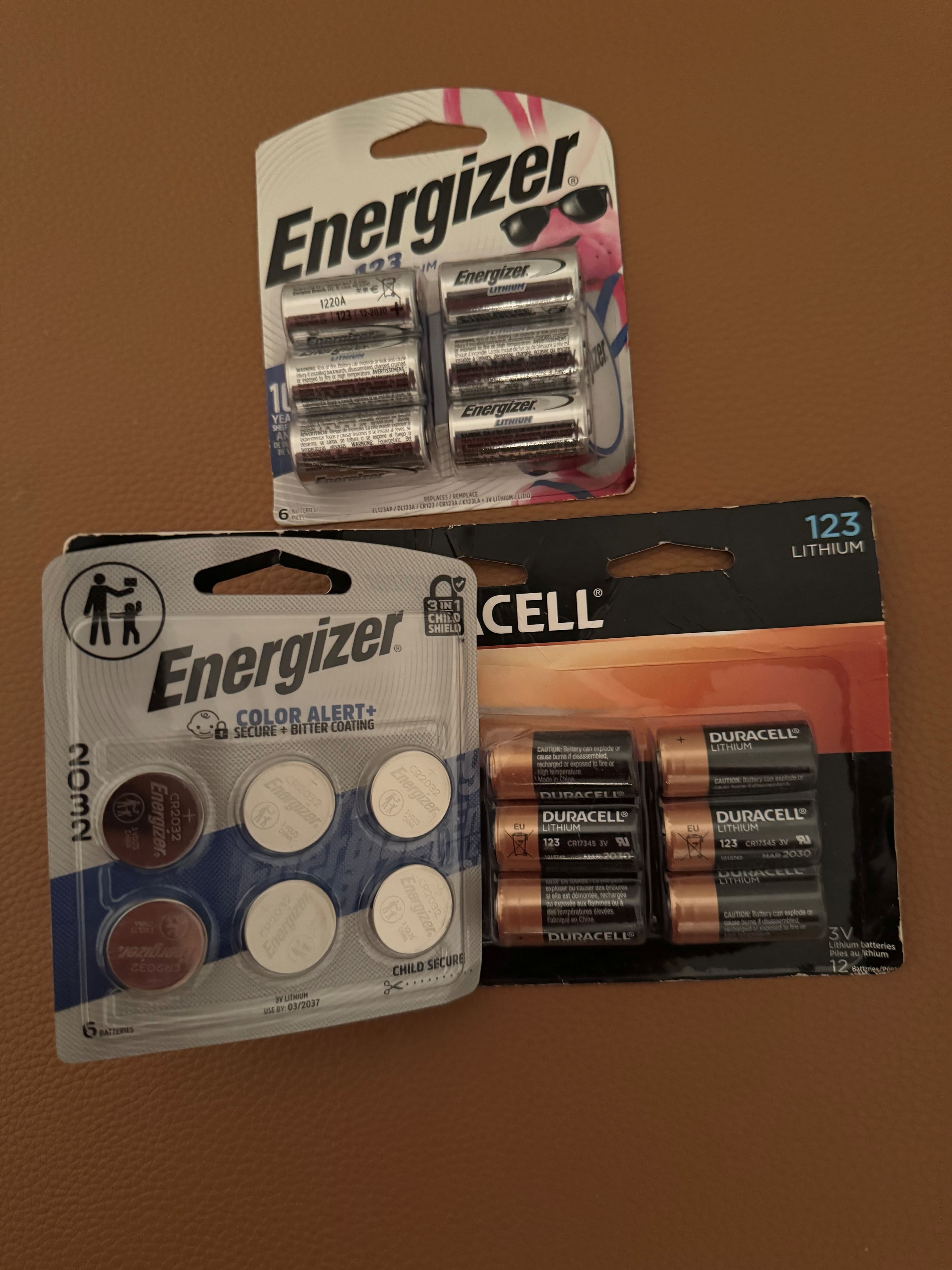 Various battery chemistries organized in labeled containers for emergency preparedness