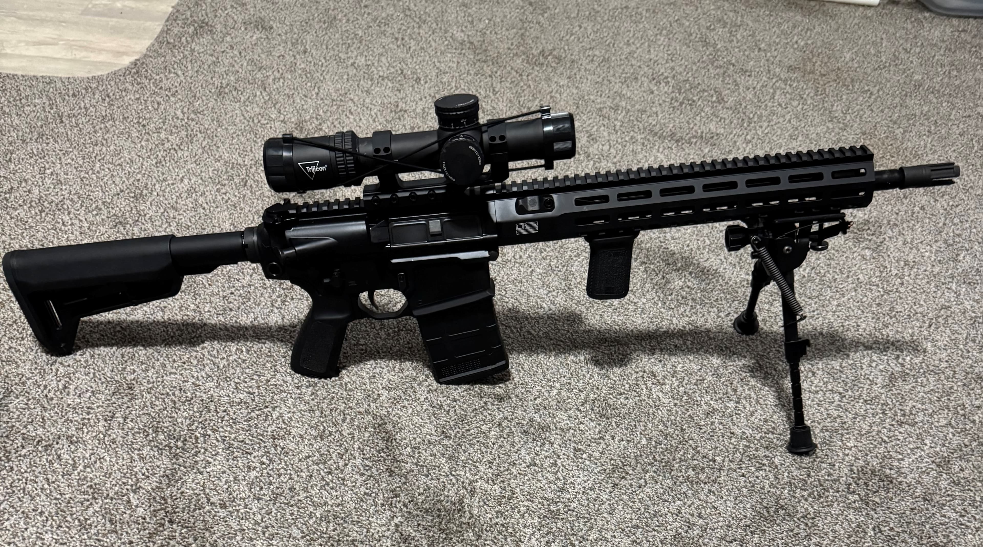 Sig Sauer 716i Tread rifle configured as a DMR on shooting bench